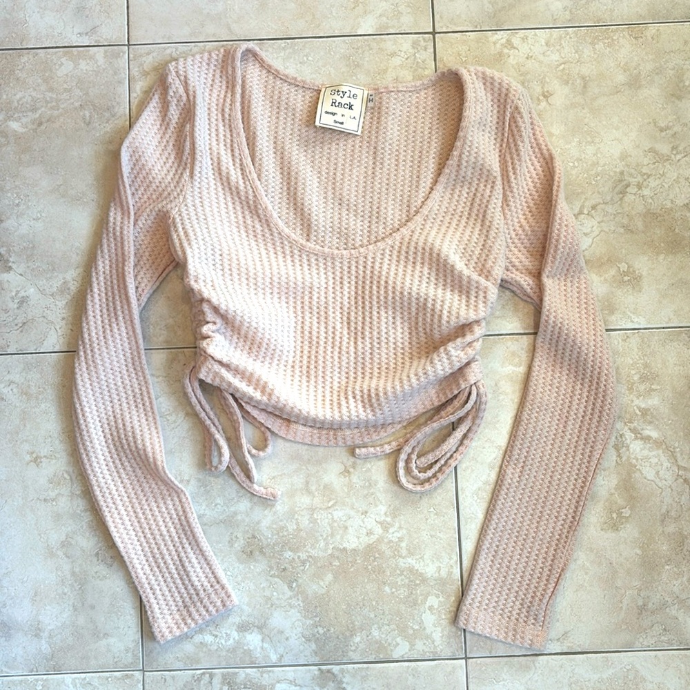 Cream waffle crop top with string sides.